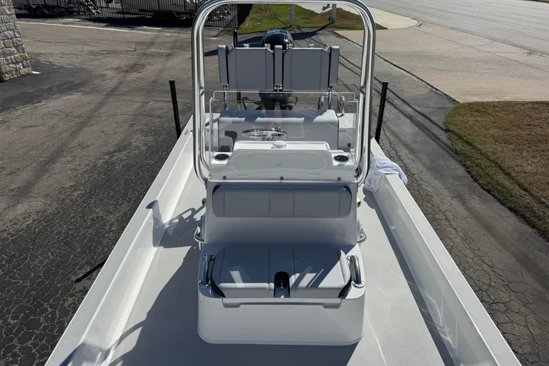 Slide: The Image of 2026 Shallow Sport 22 Sport boat, sleek design, parked on pavement, ready for adventure. - 12