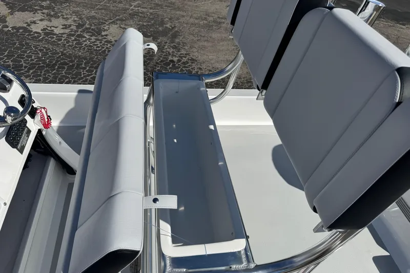 Slide: The Image of 2026 Shallow Sport 22 Sport boat interior with sleek seating and steering wheel. - 17
