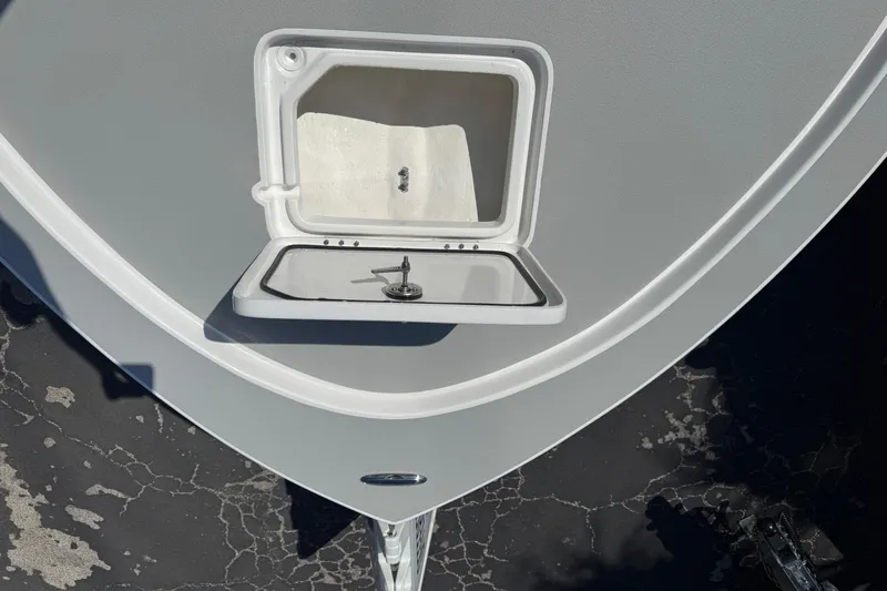 Slide: The Image of Bow of 2026 Shallow Sport 22 Sport boat with open hatch. - 21