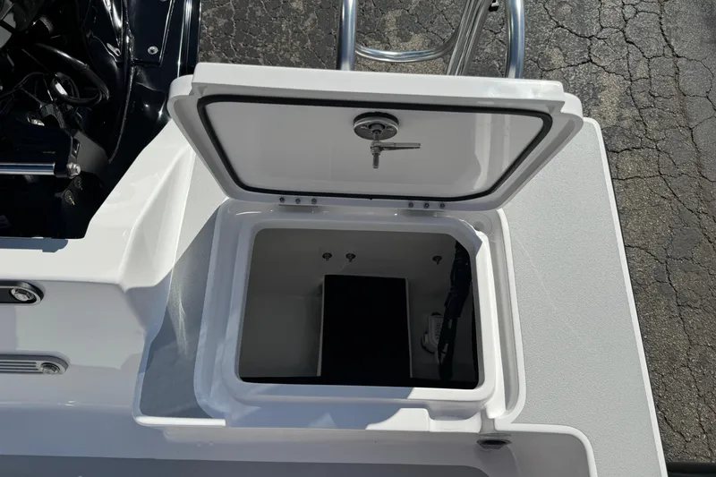 Slide: The Image of Open storage compartment on 2026 Shallow Sport 22 Sport boat, showing interior details. - 23