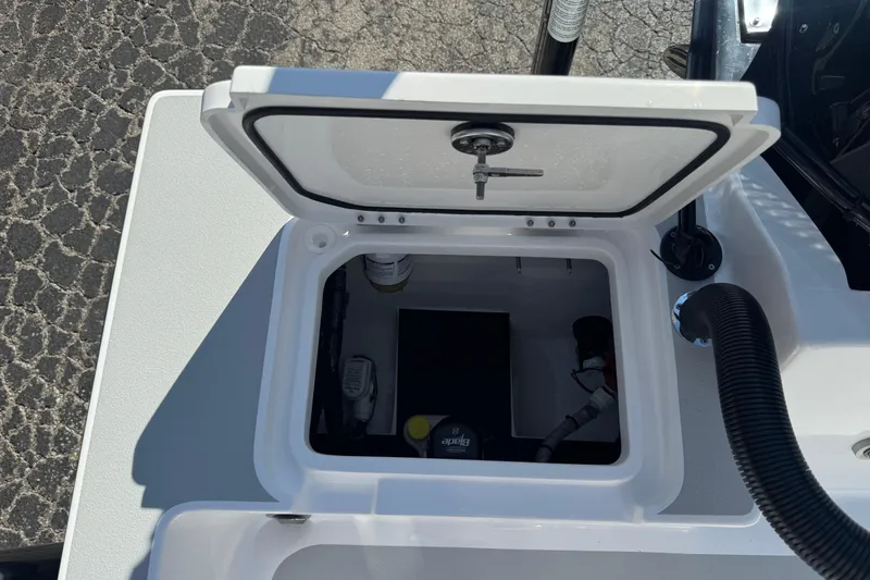 Slide: The Image of Open hatch on 2026 Shallow Sport 22 Sport boat, revealing internal compartment. - 24