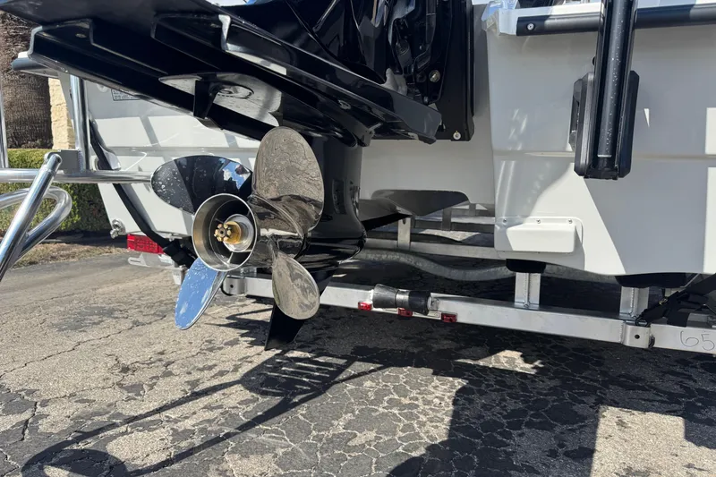 Slide: The Image of 2026 Shallow Sport 22 Sport boat propeller and trailer detail. - 3
