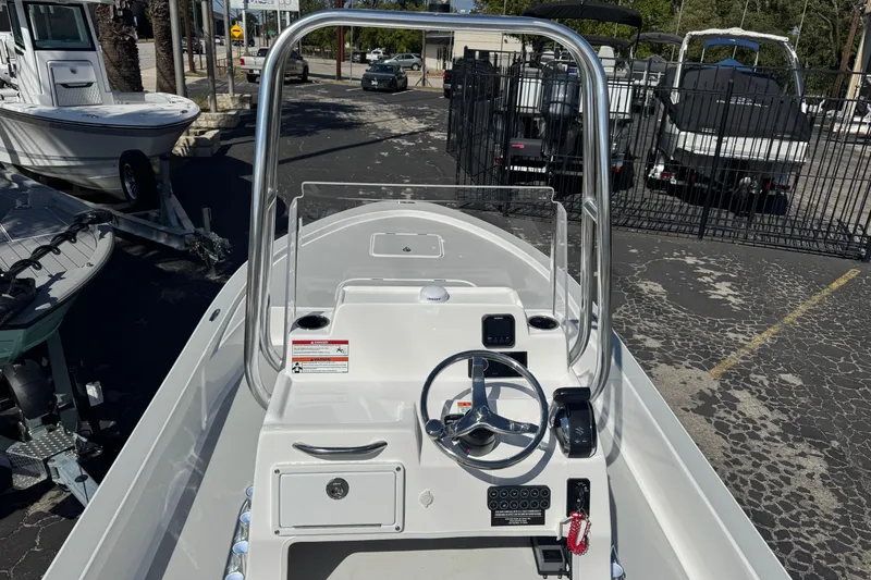Slide: The Image of 2026 Shallow Sport 22 Sport boat console with steering wheel and controls. - 6