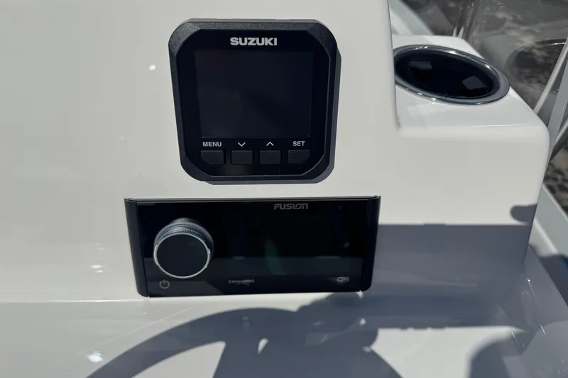 Slide: The Image of Dashboard of 2026 Shallow Sport 22 Sport boat with Suzuki and Fusion controls. - 7