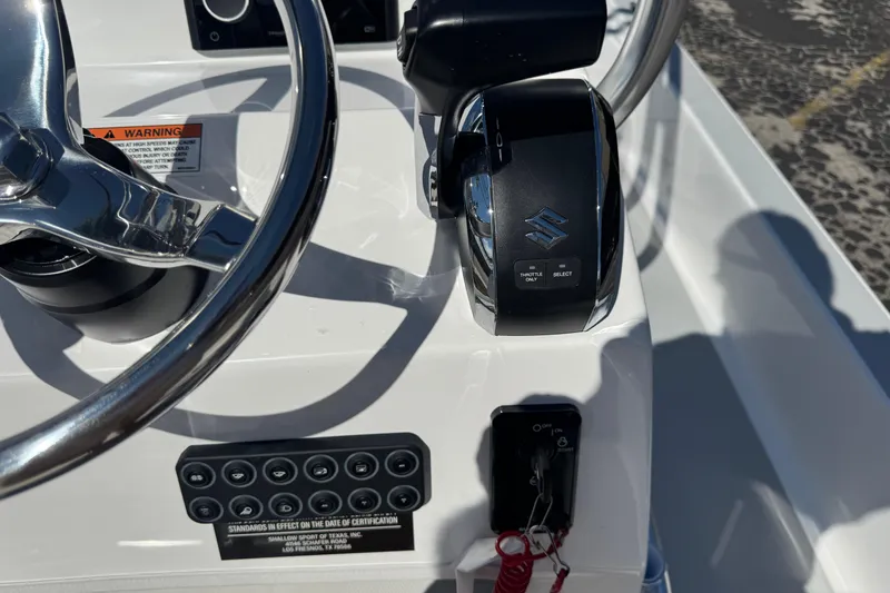 Slide: The Image of Shallow Sport 22 Sport 2026 boat console with steering wheel and controls. - 8