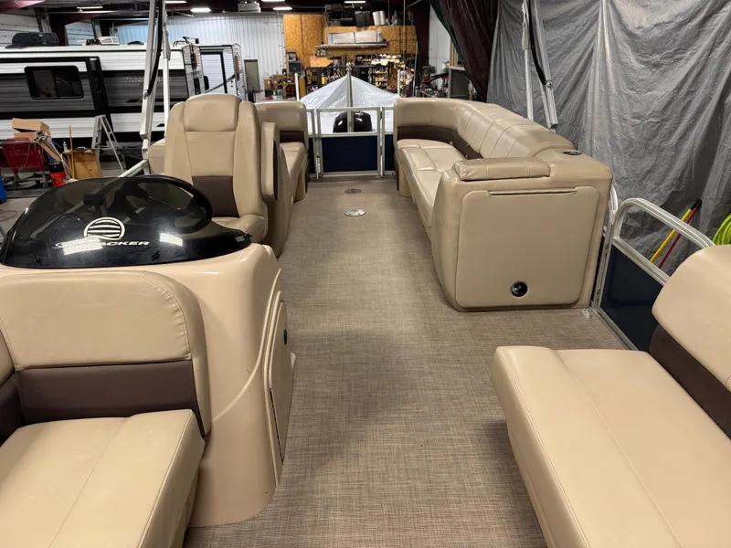 Slide: The Image of 2019 Sun Tracker Party Barge 22 XP3 interior with beige seating and helm. - 4