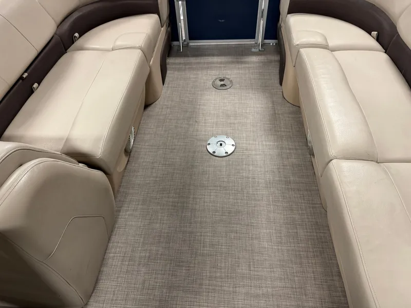 Slide: The Image of 2019 Sun Tracker Party Barge 22 XP3 interior with beige seating and carpeted floor. - 6