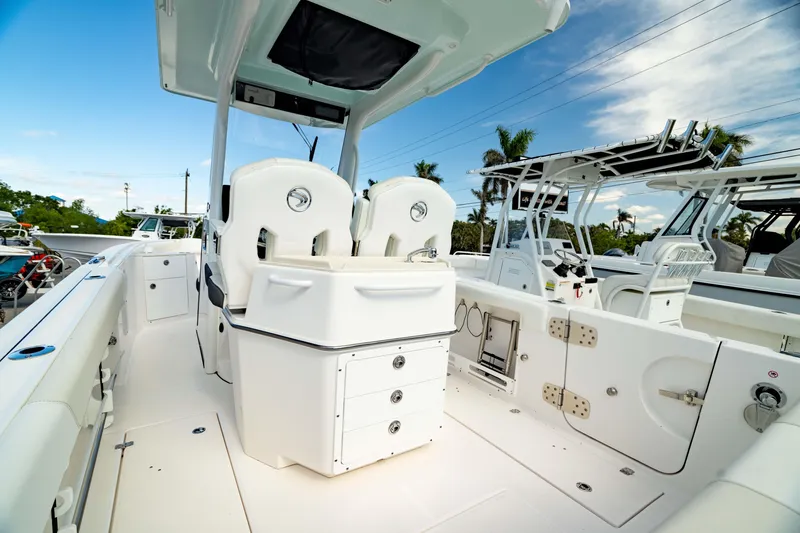 Slide: The Image of 2025 Edgewater 262CC boat interior with seating and storage, showcasing modern design and functionality. - 14