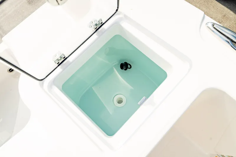 Slide: The Image of Livewell on 2025 Edgewater 262CC boat, open lid, clean water inside. - 16