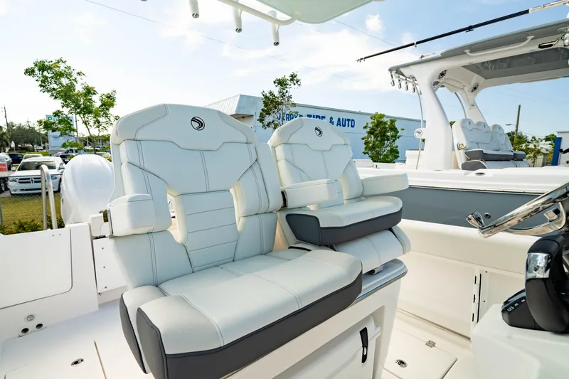 Slide: The Image of 2025 Edgewater 262CC boat with luxurious seating and modern design. - 2
