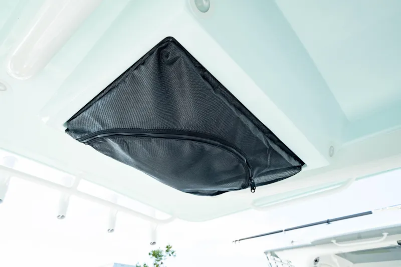 Slide: The Image of Storage compartment on 2025 Edgewater 262CC boat ceiling. - 37
