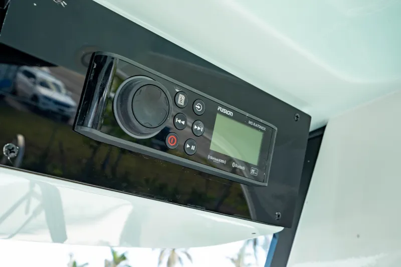 Slide: The Image of 2025 Edgewater 262CC boat audio system with control panel. - 38