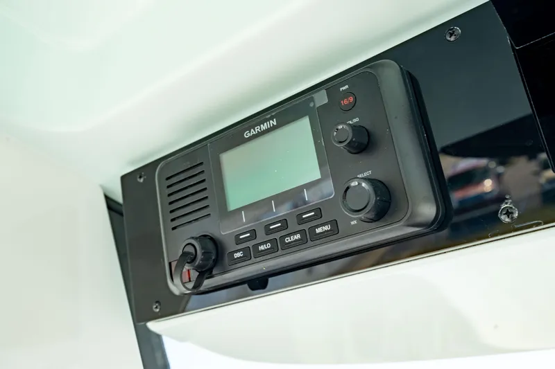 Slide: The Image of Garmin marine radio on 2025 Edgewater 262CC boat dashboard. - 40