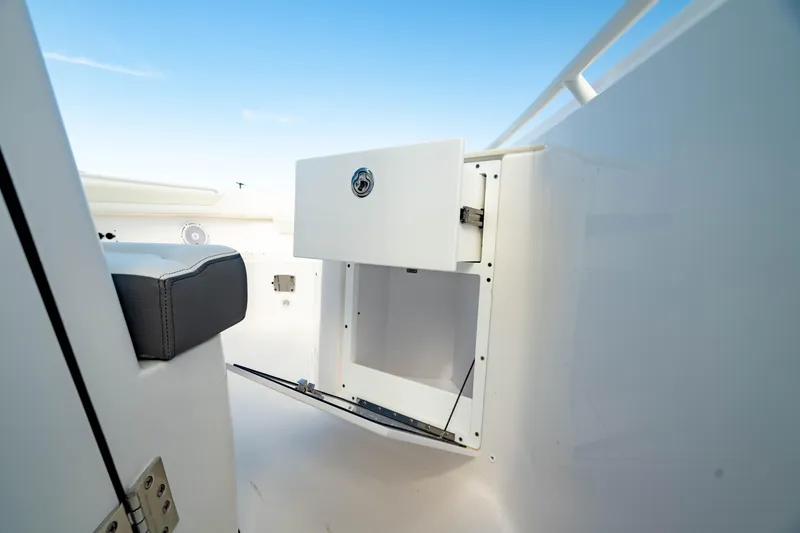 Slide: The Image of 2025 Edgewater 262CC boat interior storage compartment with open drawer. - 44