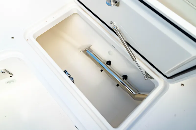 Slide: The Image of Storage compartment of 2025 Edgewater 262CC boat, featuring a sleek, white interior design. - 47