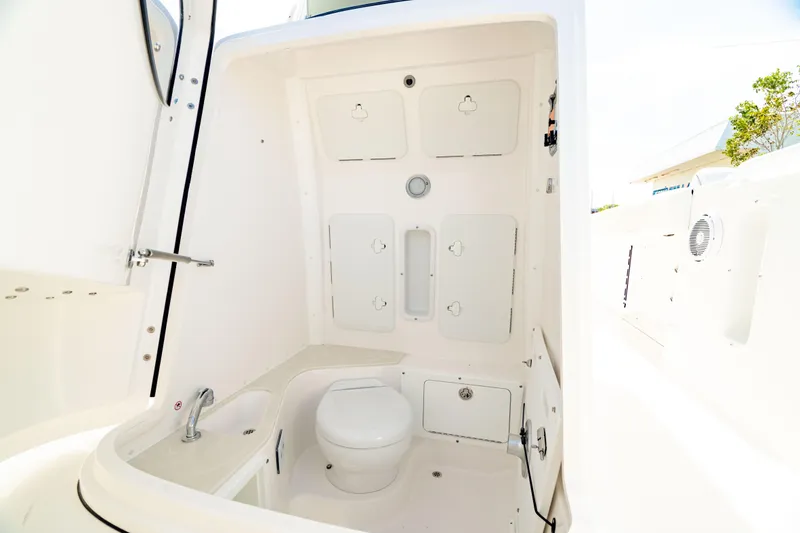 Slide: The Image of 2025 Edgewater 262CC boat interior with modern bathroom amenities. - 6