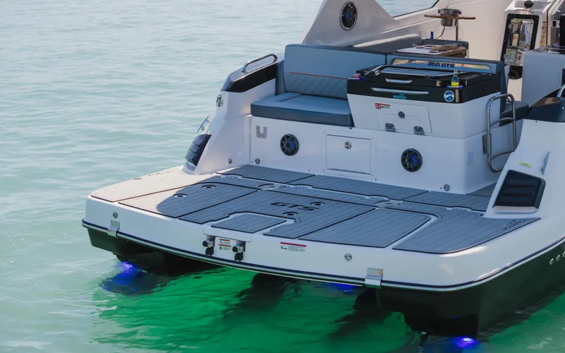 Slide: The Image of 2025 Granfort 366 GTS boat with illuminated deck on calm water. - 7