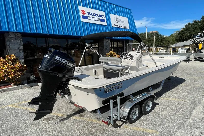 Slide: The Image of 2025 Carolina Skiff 21 LS boat with Suzuki engine at Suzuki Marine dealership. - 3