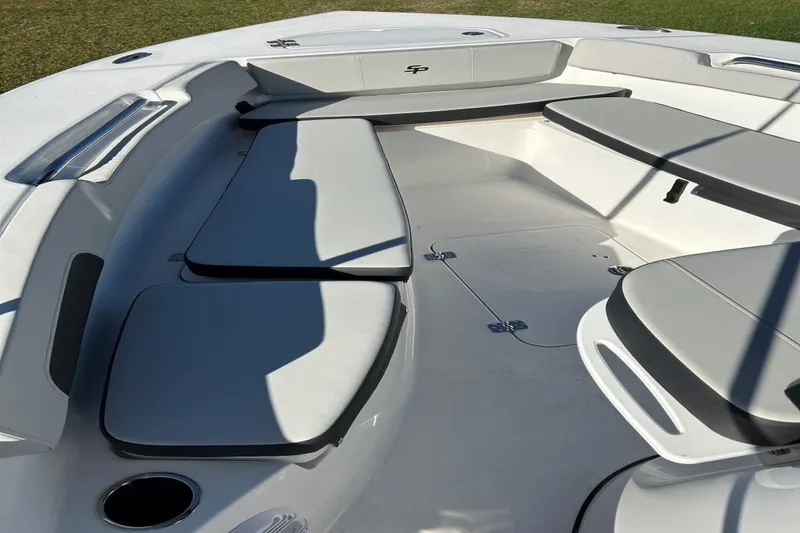 Slide: The Image of 2025 Sea Pro 202 CC boat interior with cushioned seating and storage compartments. - 3