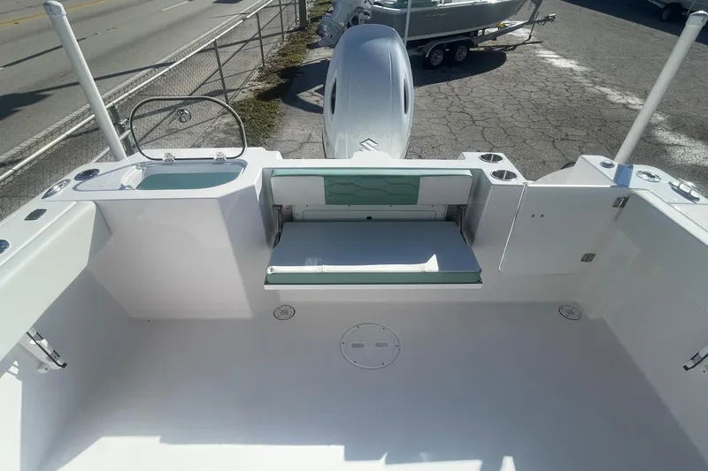 Slide: The Image of 2024 Aquasport 2200 DC boat interior with seating and storage compartments. - 3