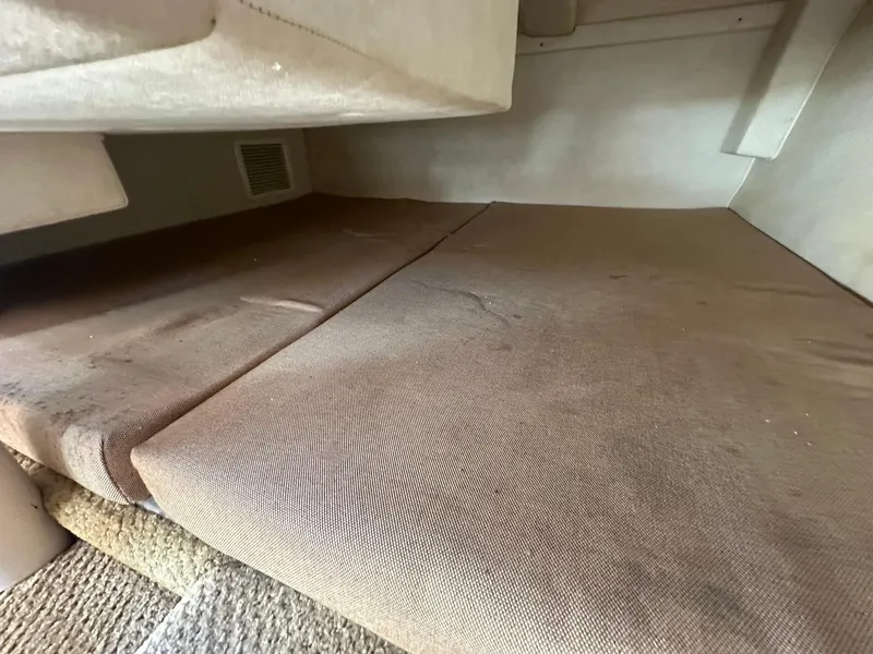 Slide: The Image of Interior cabin of 2010 Sea Ray 240 Sundancer with brown upholstery. - 14