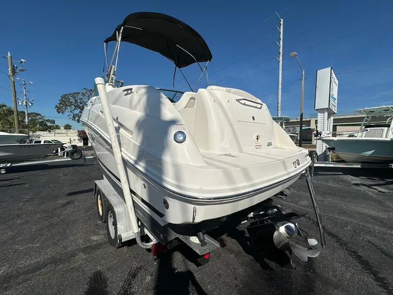 Slide: The Image of 2010 Sea Ray 240 Sundancer boat on trailer, rear view, sunny day. - 2
