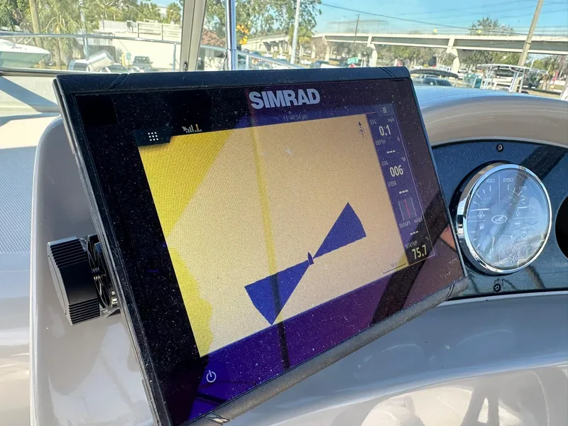 Slide: The Image of Simrad navigation display on 2010 Sea Ray 240 Sundancer boat dashboard. - 21