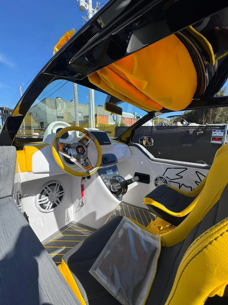 Slide: The Image of 2025 Car Off-shore Fiat 500 Abarth interior, featuring vibrant yellow and black design elements. - 23