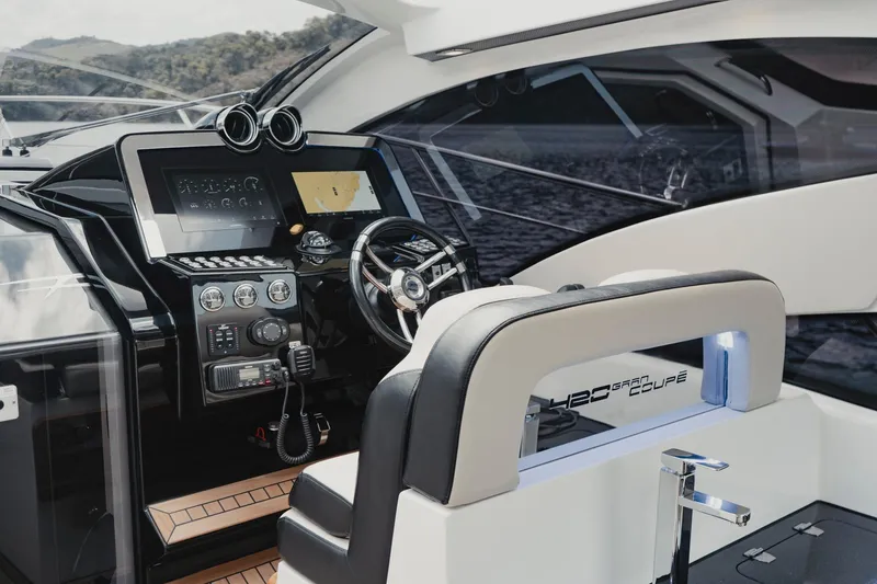 Slide: The Image of Interior of 2025 Granfort 420 Gran Coupe yacht, featuring modern dashboard and steering wheel. - 4
