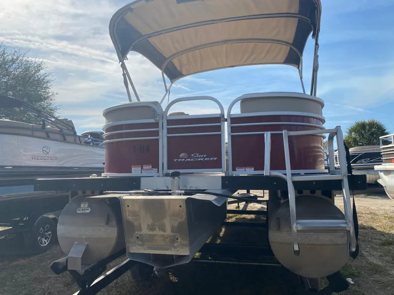 Slide: The Image of 2020 Sun Tracker Party Barge 24 DLX pontoon boat with canopy, rear view. - 5