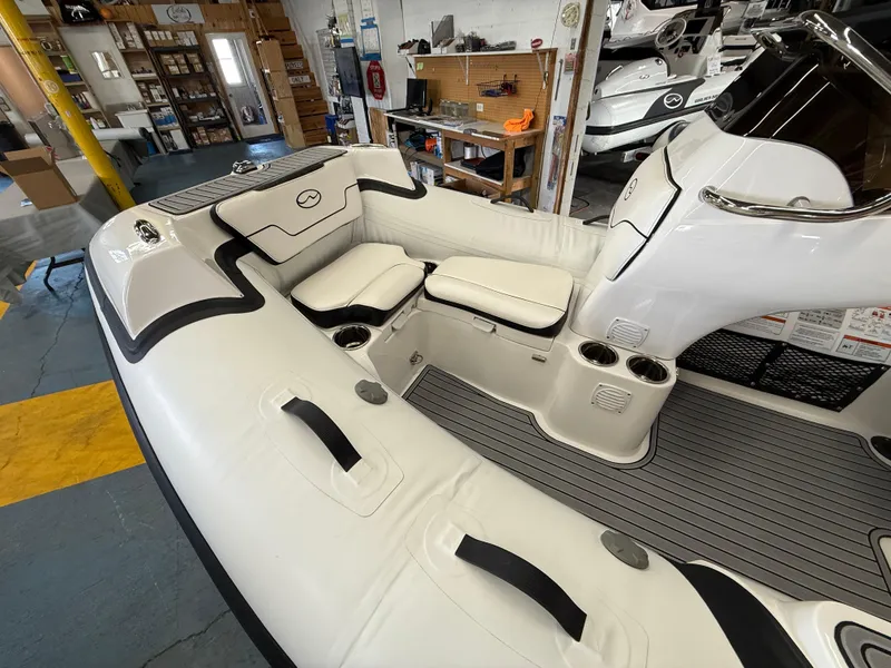 Slide: The Image of 2025 Walker Bay Generation 12 boat interior with seating and storage compartments. - 3