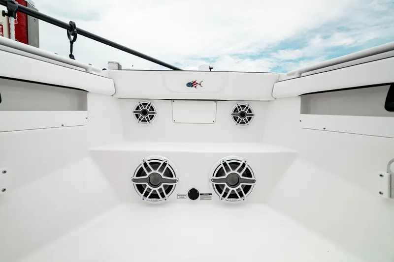 Slide: The Image of 2024 Crevalle 33 CTF boat interior with multiple speakers and white seating. - 10