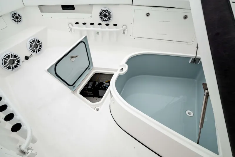 Slide: The Image of 2024 Crevalle 33 CTF boat interior with storage and livewell features. - 14