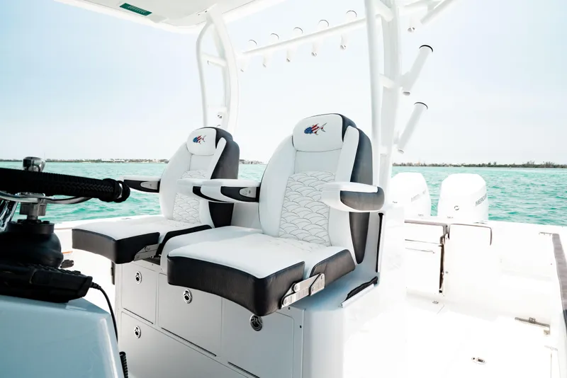 Slide: The Image of 2024 Crevalle 33 CTF boat interior with luxurious seating and ocean view. - 2
