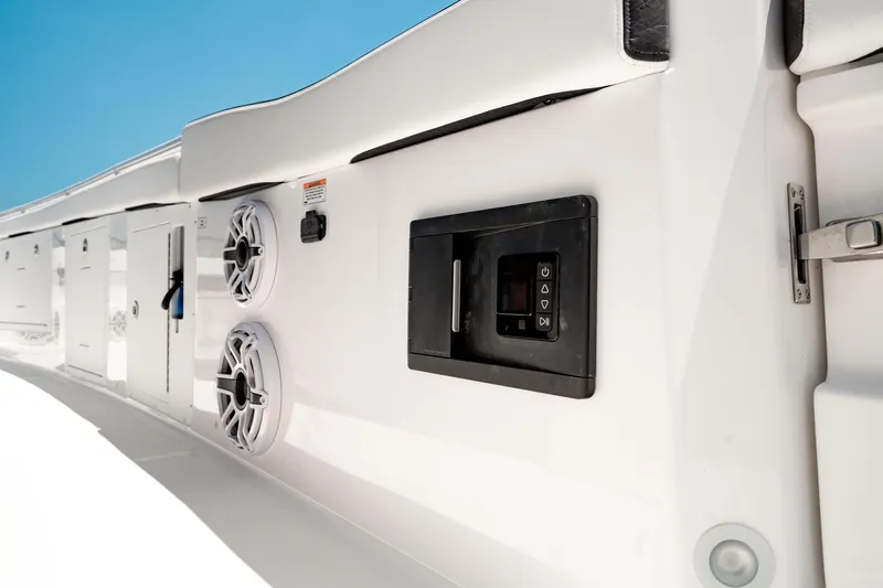 Slide: The Image of 2024 Crevalle 33 CTF boat interior with speakers and control panel. - 21