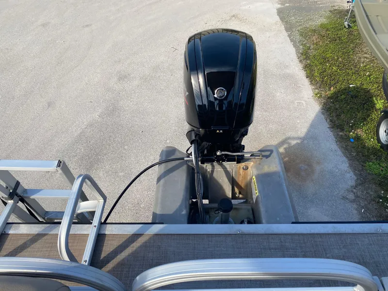 Slide: The Image of 2020 Sun Tracker Party Barge 24 DLX with outboard motor, viewed from above. - 4