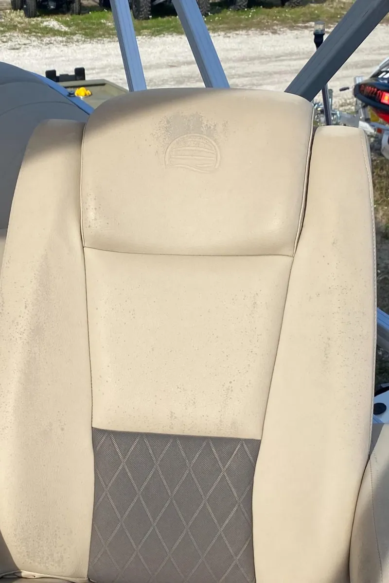 Slide: The Image of 2020 Sun Tracker Party Barge 24 DLX seat with beige and gray upholstery. - 7
