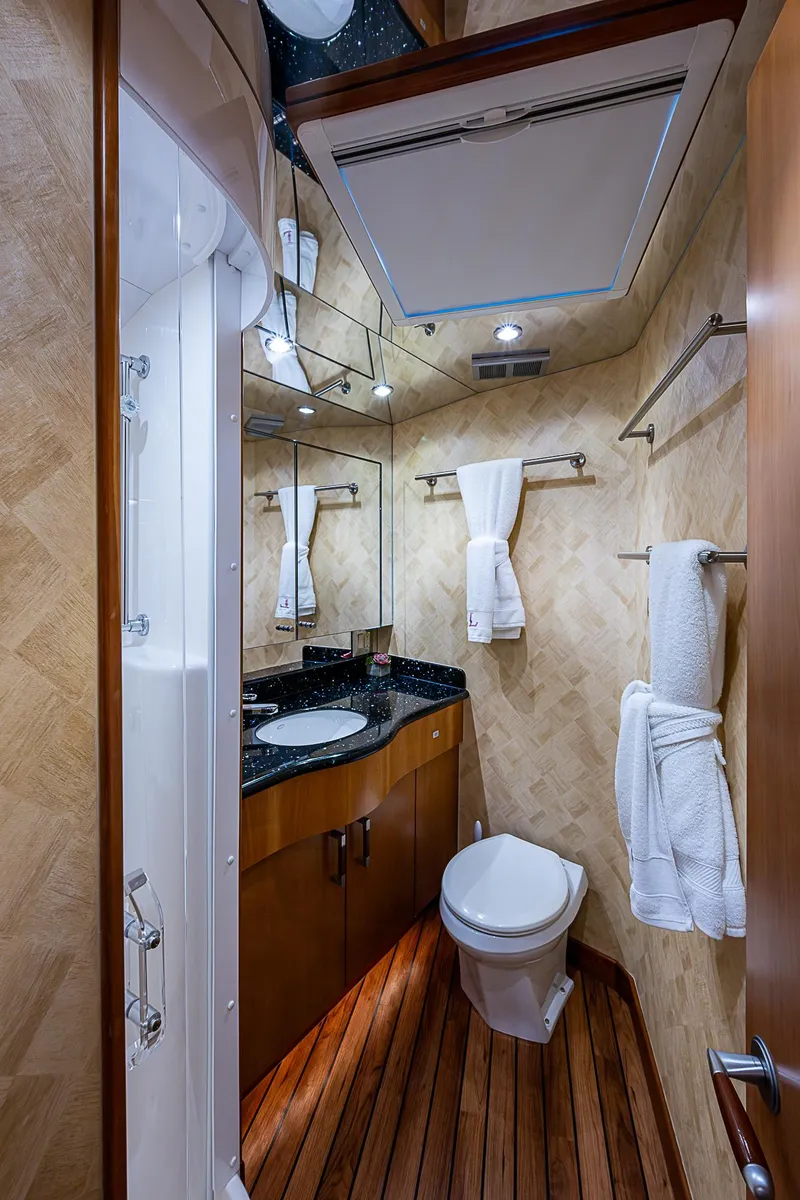 Slide: The Image of Luxurious bathroom in 2008 Hatteras 60 GT yacht with elegant wood flooring and modern fixtures. - 28