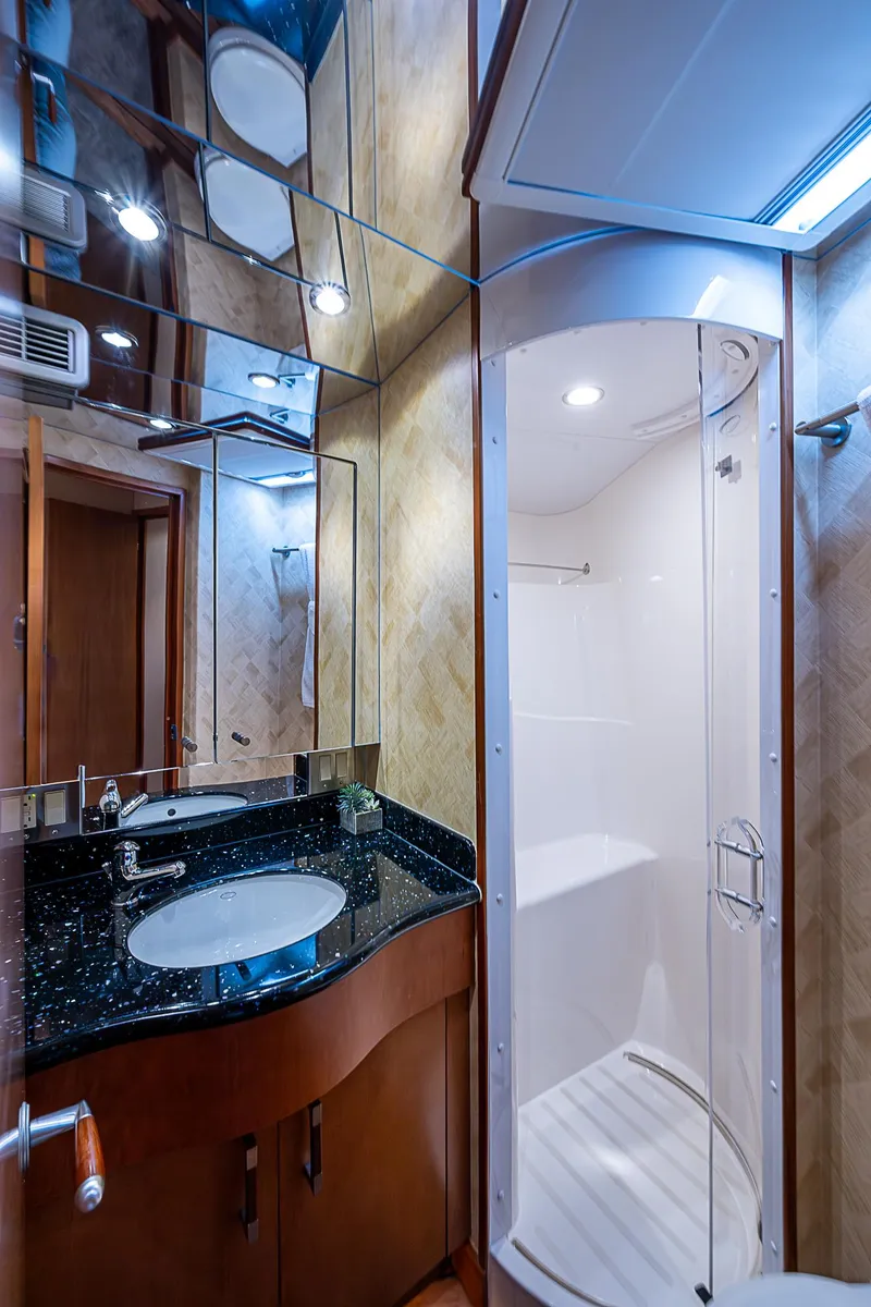 Slide: The Image of Luxurious bathroom in 2008 Hatteras 60 GT yacht with modern shower and sleek vanity. - 32