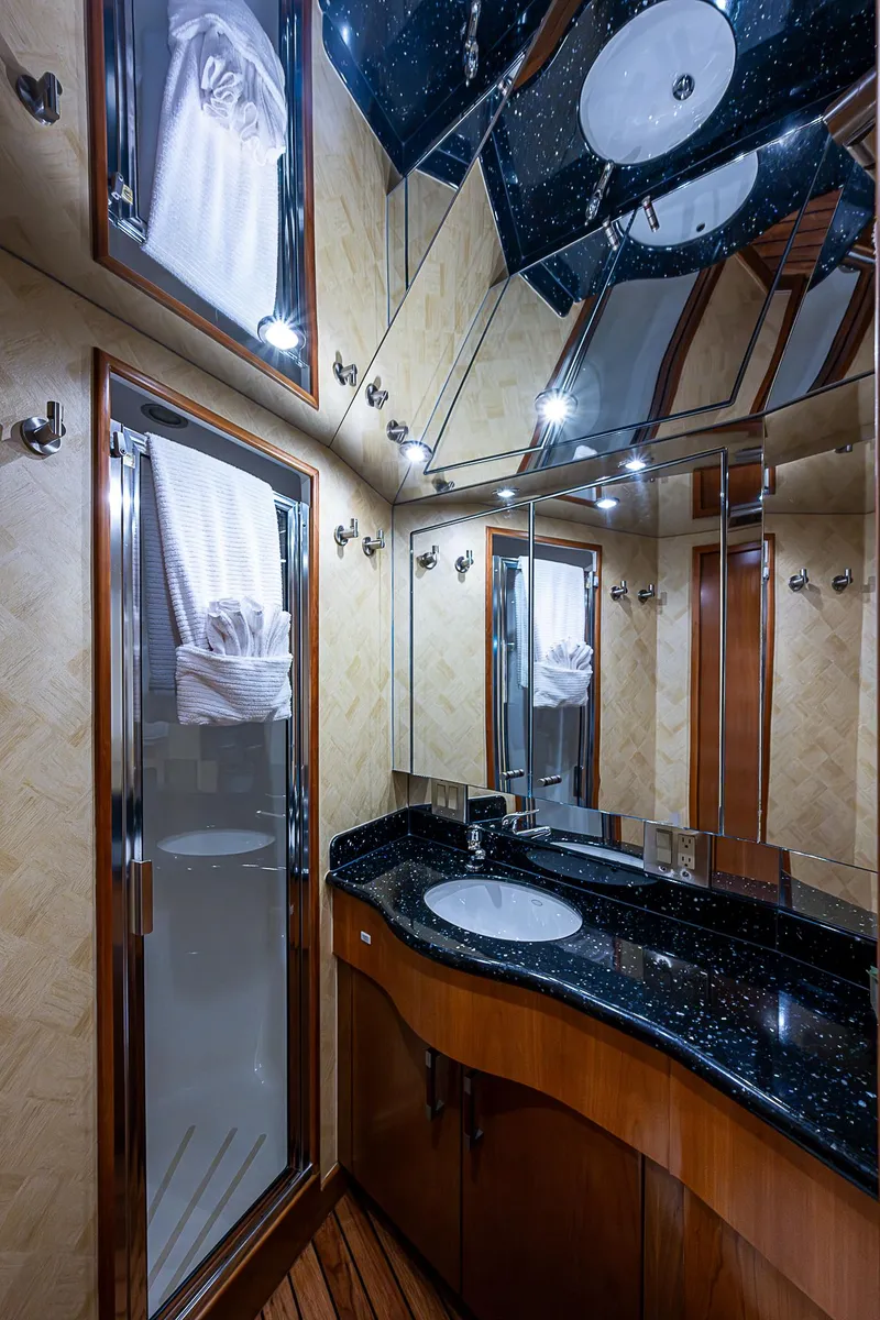 Slide: The Image of Luxurious bathroom interior of 2008 Hatteras 60 GT yacht with elegant fixtures and wood accents. - 35