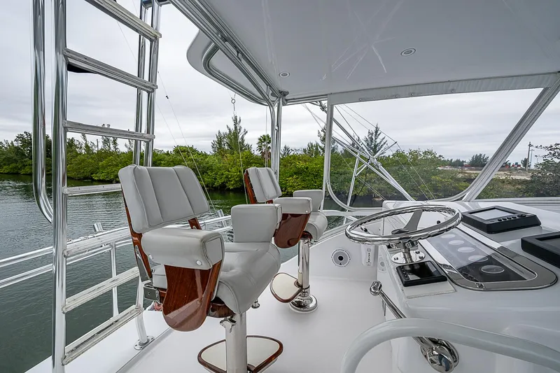 Slide: The Image of Interior view of 2008 Hatteras 60 GT yacht helm with dual captain chairs. - 36