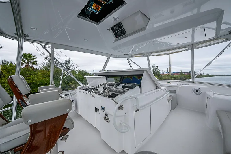 Slide: The Image of Helm of 2008 Hatteras 60 GT yacht with modern controls and seating. - 37