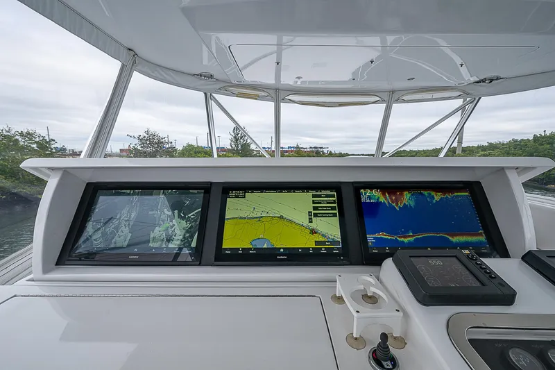 Slide: The Image of Helm of 2008 Hatteras 60 GT yacht with advanced navigation displays. - 39