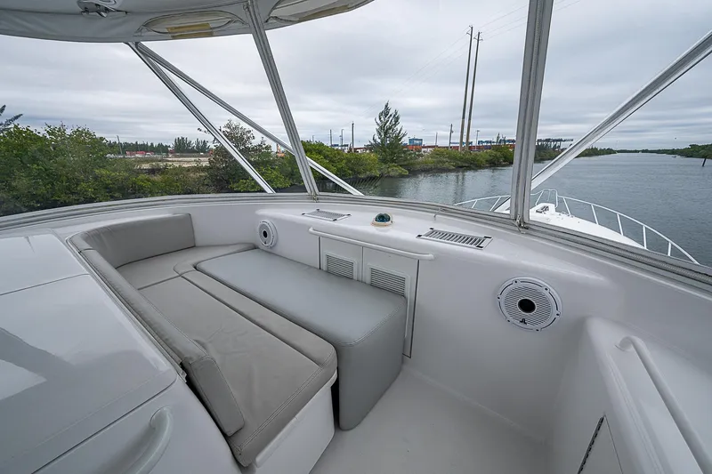 Slide: The Image of 2008 Hatteras 60 GT yacht interior with seating, overlooking waterway and greenery. - 43