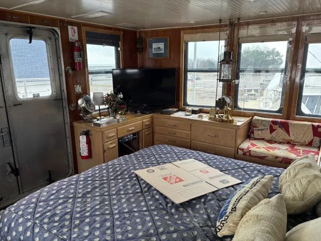 Slide: The Image of Interior of a 1991 Florida Bay Coasters 53 Trawler with cozy furnishings and decor. - 9