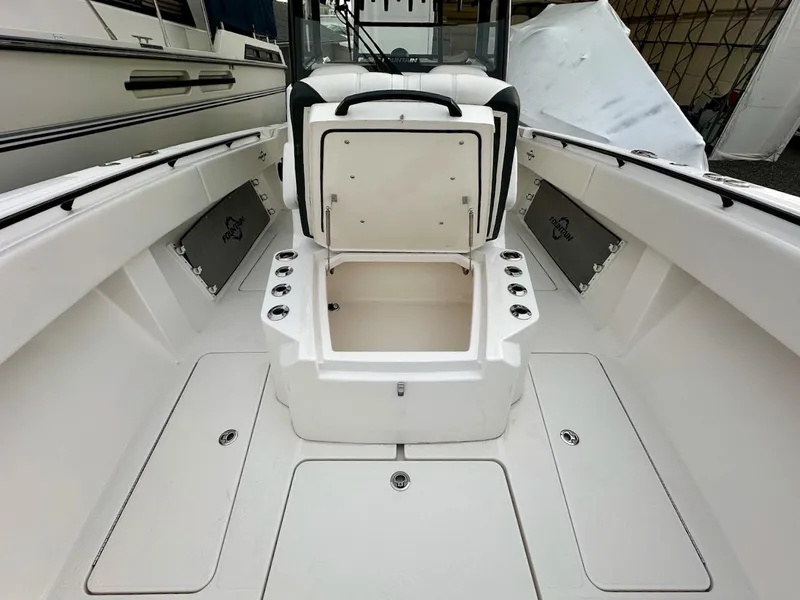Slide: The Image of 2023 Fountain Bluewater 38 Tournament Edition boat interior with open storage compartment. - 11