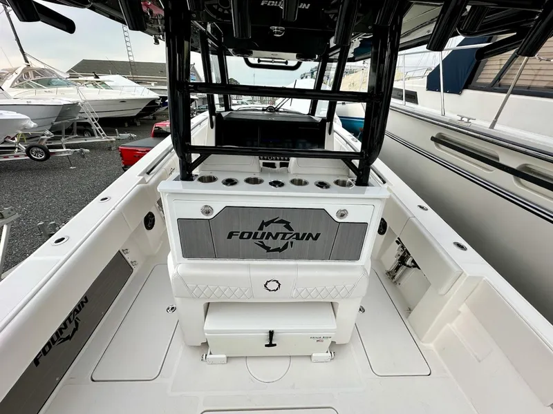 Slide: The Image of 2023 Fountain Bluewater 38 Tournament Edition boat interior with rod holders and storage. - 4