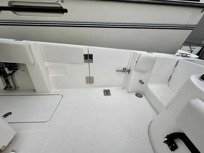 Slide: The Image of 2023 Fountain Bluewater 38 Tournament Edition boat interior, featuring sleek white deck design. - 7