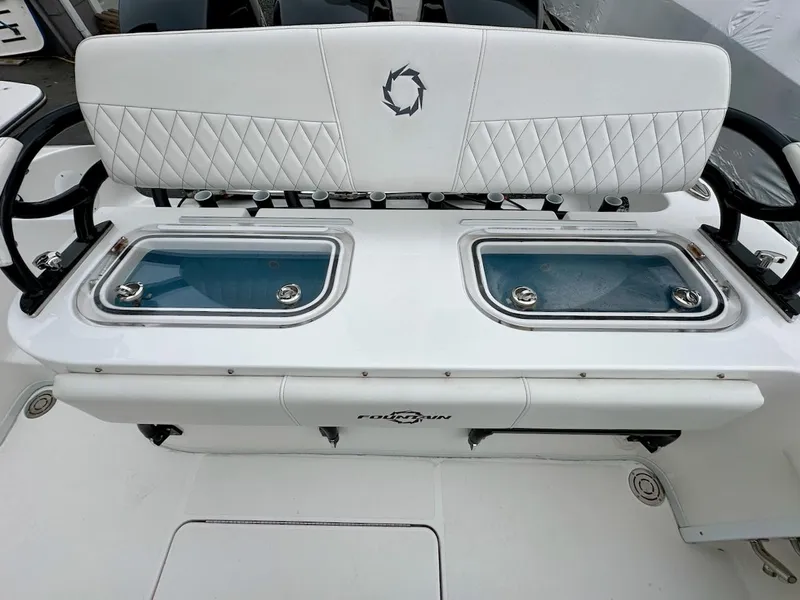 Slide: The Image of 2023 Fountain Bluewater 38 Tournament Edition boat with dual livewells and cushioned seating. - 8