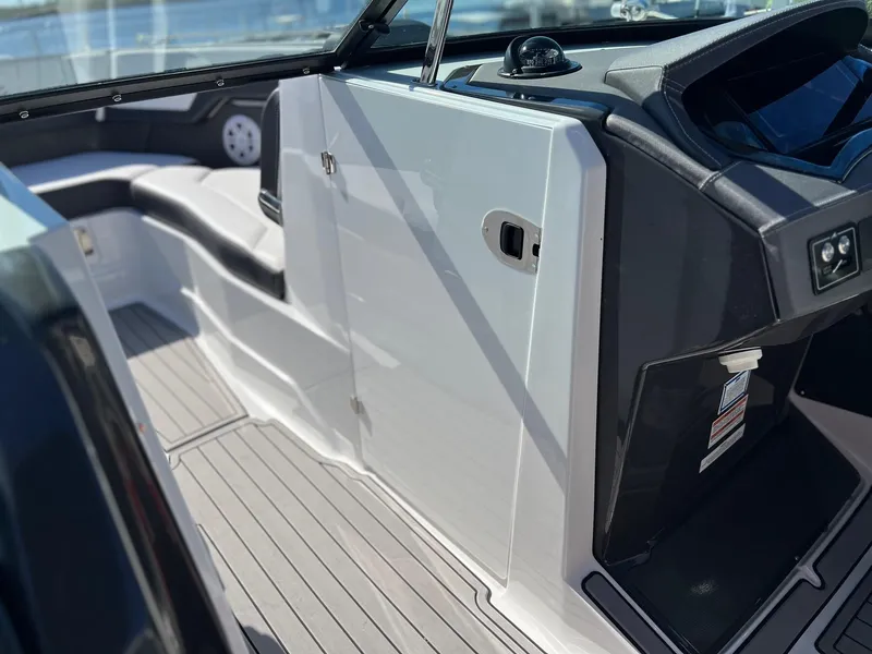 Slide: The Image of 2021 Monterey 275 Super Sport boat interior with sleek seating and modern dashboard. - 16